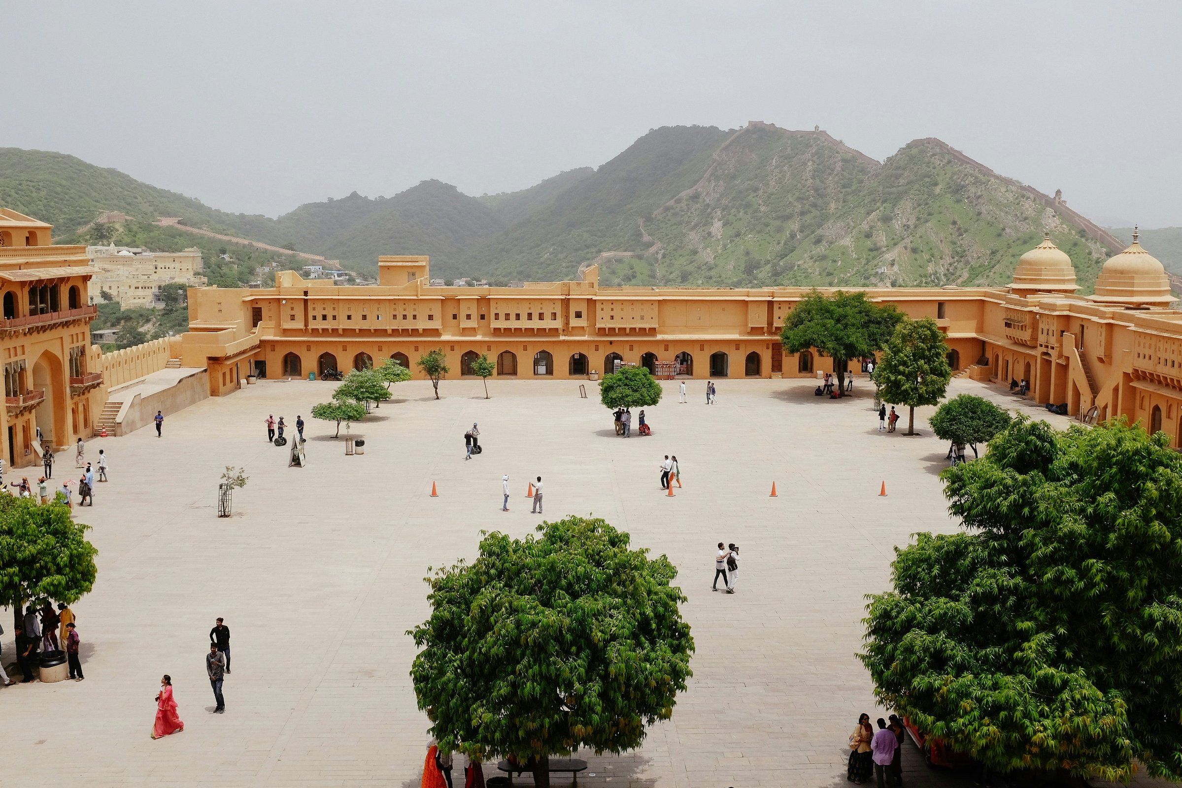 Amber Fort's sandstone ramparts rising above a lake near Jaipur, India